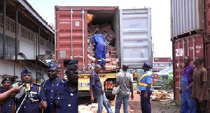 One of the goods seized containers. Inset: The Sector Command addressing the media
