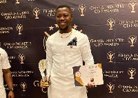 Charles Quao with his plaque