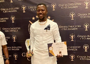 Charles Quao with his plaque