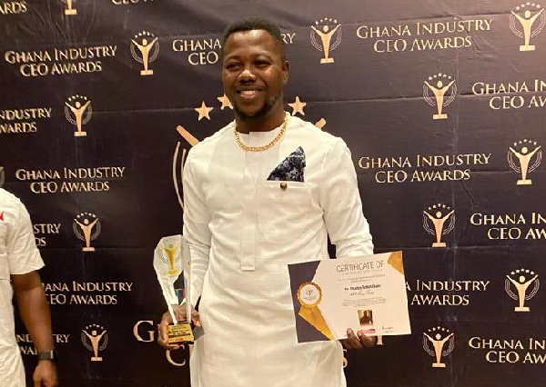 Charles Quao with his plaque