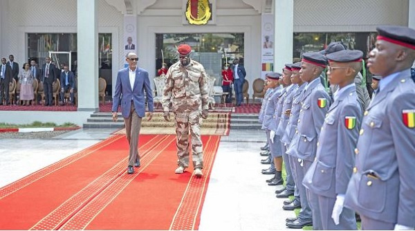 Rwanda’s President Paul Kagame (left) when he met with students at the military academy in Guinea