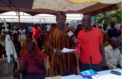 Nii Torgbor Abrenseh (in smock) addressing the media