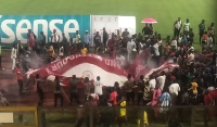 Some joyous Asante Kotoko fans chant the club's CEO Nana Yaw Amponsah's name
