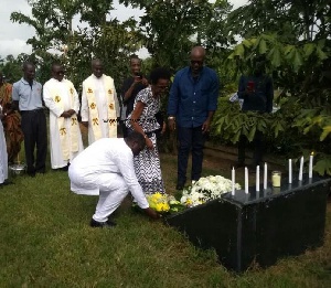 Family of late J.B. Danquah-Adu laying wreath at his tomb