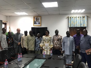 Lands Minister Kwaku Asoma-Cheremeh in a group photograph with the quarry operations