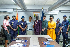 The team in a pose for a picture after the meeting