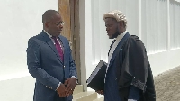 Charles Bissue in court with his lawyer