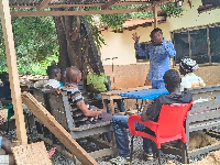 Bishop Abraham Aidoo (in blue) teaching some of the residents