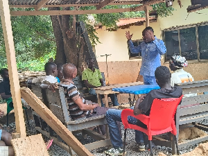 Bishop Abraham Aidoo (in blue) teaching some of the residents