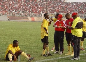 Former Asante Kotoko coach, Hans Dieter Schmidt talking to his players during 2004 Confed final