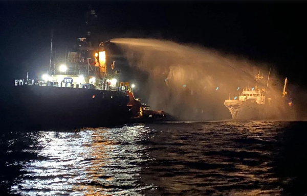 A tug boat assists Freedom Flotilla Coalition vessel Conscience off the coast of Malta