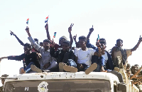 Sudanese take to the street during a rally in support of the Sudanese army in its battle against RSF