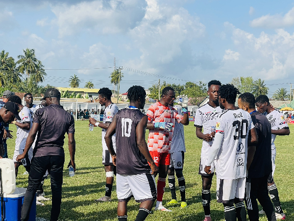 All Blacks players (in white jersey) refreshed themselves during the coolig break