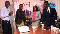 CEO of Meqasa Kelvin Nyame and co-founder of GAR Hannah Atiase shake hands after signing the deal