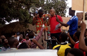 Mr Dominic Adoboe addressing a crowd in the Bator market