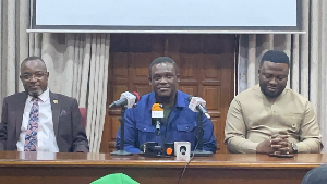 A picture of Hon Samuel Nartey George speaking with journalist