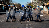 Zimbabwe police patrol near a magistrates courts in Bulawayo ahead of a planned opposition march