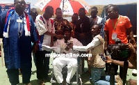 Daniel Bugri Naabu in white (seated in a wheelchair) flunked by some party faithfuls