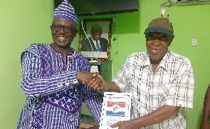 Abdallah Otito Achuliwor (left) receiving his nomination form