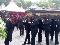 Pallbearers conveying the mortal remains of the late KABA from the tent where he was laid