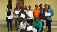 Participants in group picture with their certificates