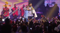 Wizkid spotted Ahmed in the crowd and brought him up to rap