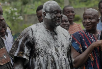Mikki Osei Berko, covered in powder, at his enstoolment