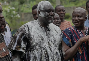 Mikki Osei Berko, covered in powder, at his enstoolment