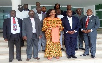 Adwoa Safo (M) in a group photograph with top management of the DVLA