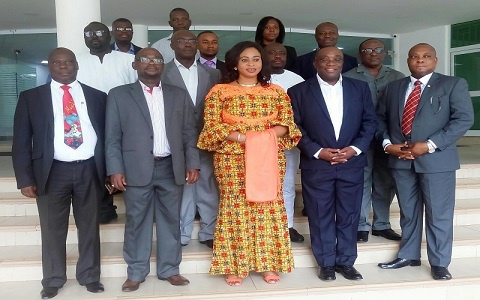 Adwoa Safo (M) in a group photograph with top management of the DVLA