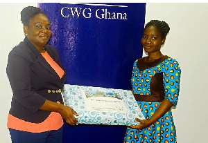 Harriet Yartey, Managing Dircetor, CWG Ghana (left) presenting the award to Edwina Borteley Abam