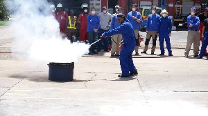 The team taking drills on how to douse fire