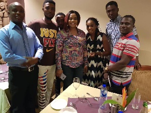 Empress Gifty Osei with some management members and bloggers