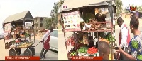 Journalist Kontonmire moves through the streets of Dansoman with his mobile shop to sell foodstuff