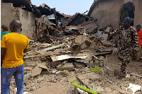 Residents inspect the damage after U.S. forces had launched a strike against Islamic State militants