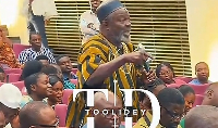 A picture of the man  speaking at the meeting