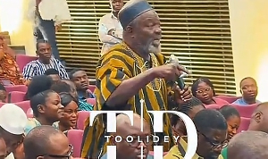 A picture of the man  speaking at the meeting