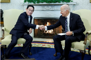 US President Joe Biden shakes hands with Japan's Prime Minister Fumio Kishida