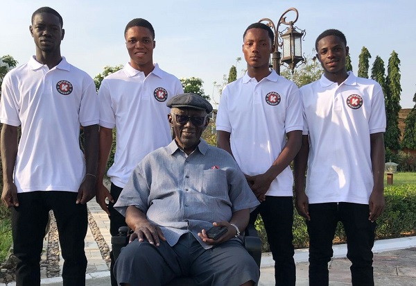 Former Ghanaian President John Agyekum Kufuor and some KFA players (in white)