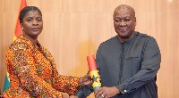 Emelia Afi Agbenyo in a picture with President Mahama