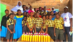 A beneficiary school in a pose with their products