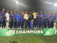 Police Ladies players and coaching staff with the Democracy Cup title
