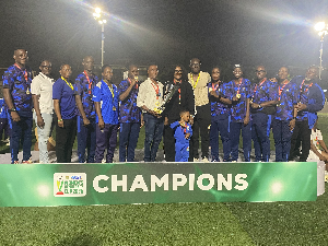 Police Ladies players and coaching staff with the Democracy Cup title