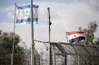 Israeli and Egyptian flags flutter at the Nitzana Crossing in Nitzana, Israel