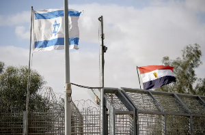 Israeli and Egyptian flags flutter at the Nitzana Crossing in Nitzana, Israel