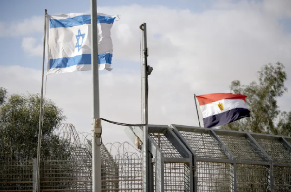 Israeli and Egyptian flags flutter at the Nitzana Crossing in Nitzana, Israel