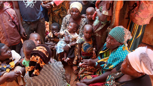 Families who fled their country, wait to be registered as refugees at Nyarugusu camp, Tanzania