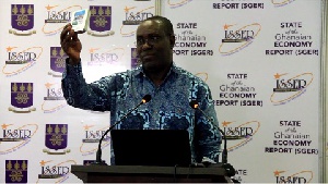 General Secretary for TUC, Dr. Anthony Yaw Baah, launching the digitized form of the report