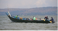 A private boat with passengers leaving Masese landing site in Jinja, Uganda.