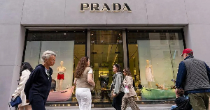 Some shoppers around a Prada shop